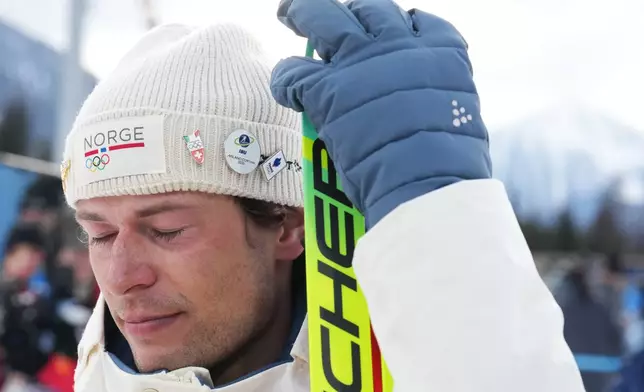 Sturla Holm Laegreid, of Norway, reacts after he won bronze in the men's 20-kilometer individual biathlon race at the 2026 Winter Olympics in Anterselva, Italy, Tuesday, Feb. 10, 2026. (AP Photo/Andrew Medichini)