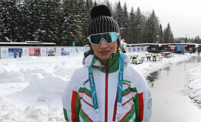 Iran's coach for Alpine women's skiing, Mitra Kalhor poses for a photo at the Cortina Olympic Village, during the 2026 Winter Olympics, in Cortina d'Ampezzo, Italy, Thursday Feb. 5, 2026. (AP Photo/Jennifer McDermott)