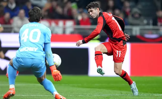 AC Milan's Christian Pulisic, right, in action during the Italian Serie A soccer match between AC Milan and Parma in Milan, Italy, Sunday, Feb. 22 , 2025. (Spada/LaPresse via AP)