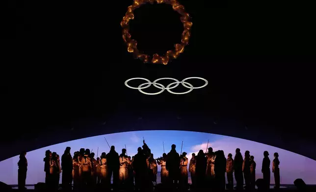 Performers participate in the closing ceremony of the 2026 Winter Olympics, in Verona, Italy, Sunday, Feb. 22, 2026. (AP Photo/Natacha Pisarenko)