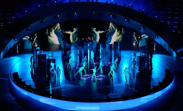 Artists perform during the closing ceremony of the 2026 Winter Olympics, in Verona, Italy, Sunday, Feb. 22, 2026. (AP Photo/Bernat Armangue)