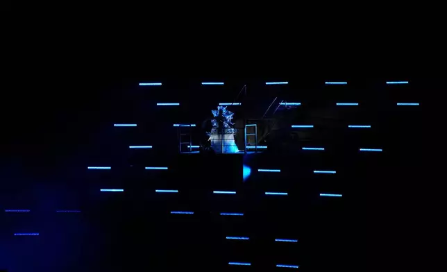 Artists perform during the closing ceremony of the 2026 Winter Olympics, in Verona, Italy, Sunday, Feb. 22, 2026. (AP Photo/Bernat Armangue)