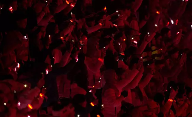 Athletes attend the closing ceremony of the 2026 Winter Olympics, in Verona, Italy, Sunday, Feb. 22, 2026. (AP Photo/Ashley Landis)