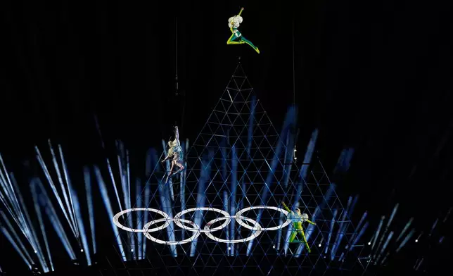 Performers participate in the closing ceremony of the 2026 Winter Olympics, in Verona, Italy, Sunday, Feb. 22, 2026. (AP Photo/Natacha Pisarenko)