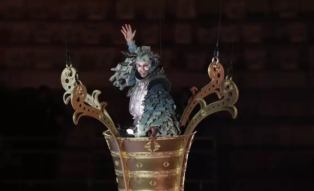 An artist performs during the closing ceremony of the 2026 Winter Olympics, in Verona, Italy, Sunday, Feb. 22, 2026. (AP Photo/Antonio Calanni)