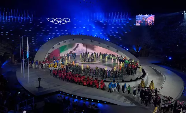 Athletes attend the closing ceremony of the 2026 Winter Olympics, in Verona, Italy, Sunday, Feb. 22, 2026. (AP Photo/Ashley Landis)