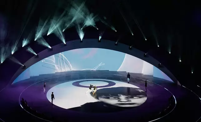 Artists perform during the closing ceremony of the 2026 Winter Olympics, in Verona, Italy, Sunday, Feb. 22, 2026. (AP Photo/Bernat Armangue)