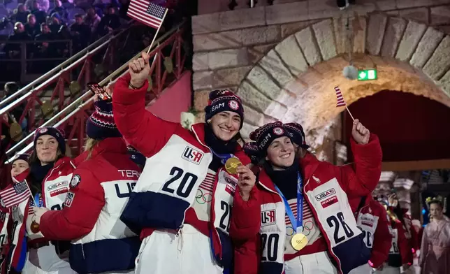 Athletes from the United States attend the closing ceremony of the 2026 Winter Olympics, in Verona, Italy, Sunday, Feb. 22, 2026. (AP Photo/Natacha Pisarenko)