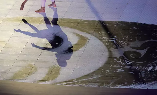 Artists perform during the closing ceremony of the 2026 Winter Olympics, in Verona, Italy, Sunday, Feb. 22, 2026. (AP Photo/Antonio Calanni)