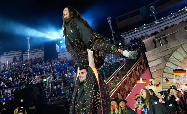 Athletes from Germany attend the closing ceremony of the 2026 Winter Olympics, in Verona, Italy, Sunday, Feb. 22, 2026. (AP Photo/Natacha Pisarenko)