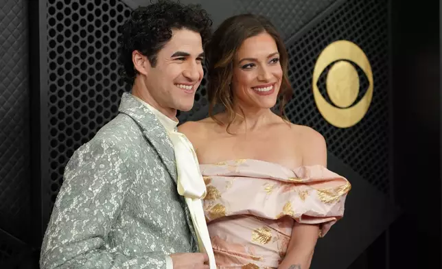 Darren Criss, left, and Mia Swier arrive at the 68th annual Grammy Awards on Sunday, Feb. 1, 2026, in Los Angeles. (Photo by Jordan Strauss/Invision/AP)