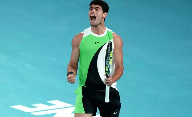 Carlos Alcaraz of Spain reacts during the men's singles final match against Novak Djokovic of Serbia at the Australian Open tennis championship in Melbourne, Australia, Sunday, Feb. 1, 2026.(AP Photo/Mark Baker)