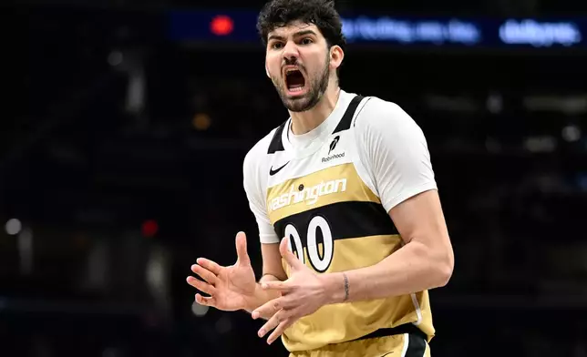 Washington Wizards forward Tristan Vukcevic yells at the official claiming he was fouled during the first half of an NBA basketball game against the Miami Heat, Sunday, Feb. 8, 2026, in Washington. (AP Photo/John McDonnell)