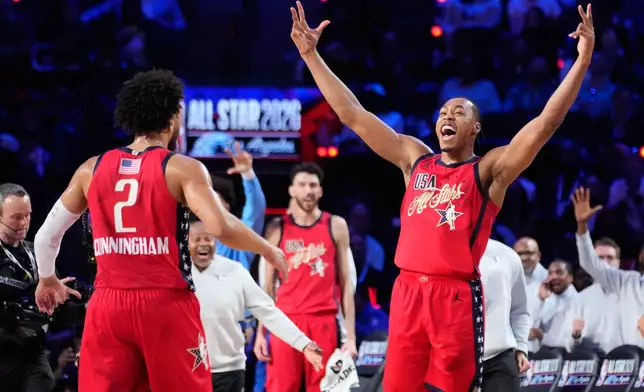 USA Stars forward Scottie Barnes, center, celebrates with guard Cade Cunningham after a win over World during the NBA All-Star basketball game Sunday, Feb. 15, 2026, in Inglewood, Calif. (AP Photo/Mark J. Terrill)