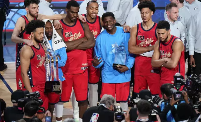 USA Stars pose for photos after a win over USA Stripes in the NBA All-Star basketball game Sunday, Feb. 15, 2026, in Inglewood, Calif. (AP Photo/Jae C. Hong)