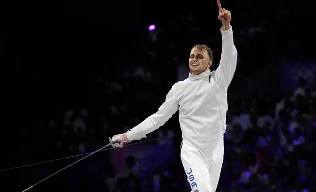 FILE - United States' Nick Itkin celebrates after winning the men's individual Foil bronze final match against Japan's Kazuki Iimura during the 2024 Summer Olympics at the Grand Palais, July 29, 2024, in Paris, France. (AP Photo/Andrew Medichini, File)