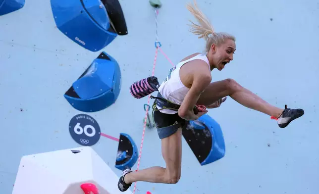FILE - Janja Garnbret of Slovenia competes in the women's boulder and lead, lead final, during the sport climbing competition at the 2024 Summer Olympics, Aug. 10, 2024, in Le Bourget, France. (AP Photo/Tsvangirayi Mukwazhi, File)