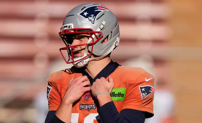 New England Patriots quarterback Drake Maye watches a drill during practice ahead of the Super Bowl 60 NFL football game against the Seattle Seahawks, Wednesday, Feb. 4, 2026, in Stanford, Calif. (AP Photo/Charlie Riedel)