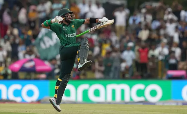 Pakistan's Sahibzada Farhan celebrates his century during the T20 World Cup cricket match between Namibia and Pakistan in Colombo, Sri Lanka, Wednesday, Feb. 18, 2026. (AP Photo/Eranga Jayawardena)
