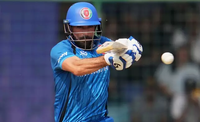 Afghanistan's Ibrahim Zardan plays a shot during the T20 World Cup cricket match between Afghanistan and United Arab Emirates in New Delhi, India, Monday, Feb. 16, 2026. (AP Photo/Manish Swarup)