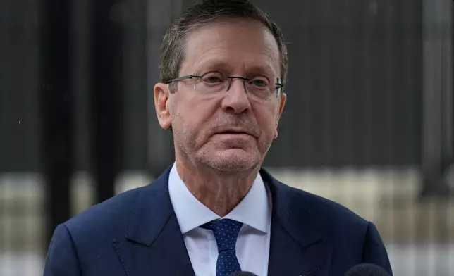 Israel's President Isaac Herzog speaks during his visit to Bondi Beach where the Dec. 2025 shooting took place, in Sydney, Monday, Feb. 9, 2026. (AP Photo/Rick Rycroft)