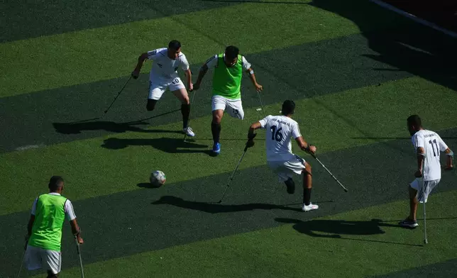 Palestinian amputee soccer players train on a newly built field in Gaza City, Wednesday, Feb. 11, 2026. (AP Photo/Jehad Alshrafi)