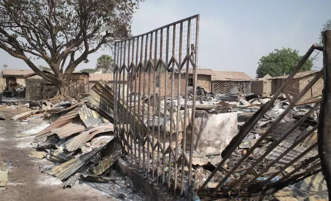 Homes sit in ruins days after an attack in the village of Woro, Nigeria, Thursday, Feb. 5, 2026. (AP Photo/Pelumi Salako)