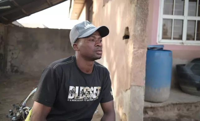 Umar Bio Kabir, a 26-year-old schoolteacher who survived by running when the attackers arrived in the village of Woro, looks on in Woro, Nigeria, Thursday, Feb. 5, 2026. (AP Photo/Pelumi Salako)