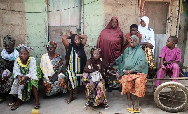 Survivors gather on the third day of Islamic prayers for one of the victims of an extremist attack, in Kaiama, Nigeria, Friday, Feb. 6, 2026. (AP Photo/Pelumi Salako)