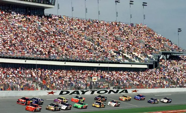 FILE - Drivers take the green flag to start the Bud Shootout race, Feb. 7, 1999, at the Daytona International Speedway in Daytona Beach, Fla. (AP Photo/Chris O'Meara, File)