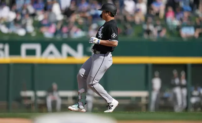 Chicago White Sox's Munetaka Murakami, of Japan, arrives at second base after hitting a two-run double against the Chicago Cubs during the fourth inning of a spring training baseball game Friday, Feb. 20, 2026, in Mesa, Ariz. (AP Photo/Ross D. Franklin)