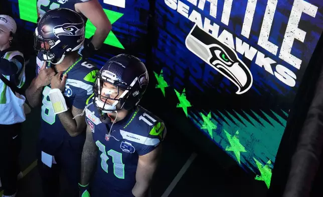 Seattle Seahawks quarterback Jalen Milroe (6) and wide receiver Jaxon Smith-Njigba (11) wait to take the field for the NFL Super Bowl 60 football game against the New England Patriots, Sunday, Feb. 8, 2026, in Santa Clara, Calif. (AP Photo/Godofredo A. Vásquez)