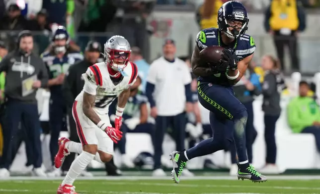 Seattle Seahawks wide receiver Jaxon Smith-Njigba (11) makes a catch during the second half of the NFL Super Bowl 60 football game against the New England Patriots, Sunday, Feb. 8, 2026, in Santa Clara, Calif. (AP Photo/Matt Slocum)