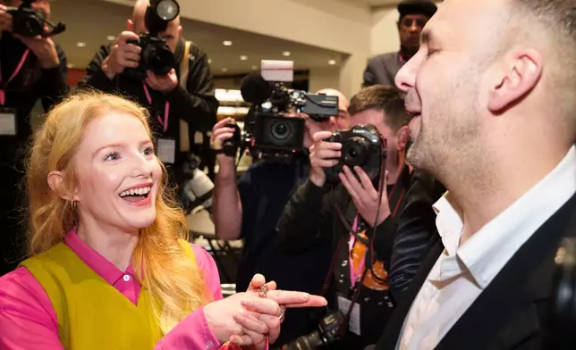 The Greens Party candidate Hannah Spencer, left, stands with party leader Zack Polanski after winning the Gorton and Denton by-election, Manchester, England, Thursday, Feb. 26, 2026. (AP Photo/Jon Super)