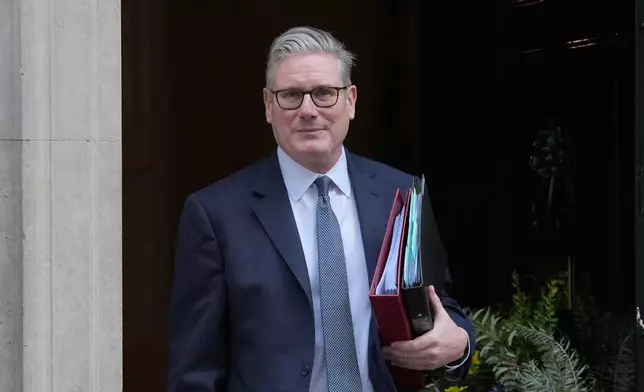 Britain's Prime Minister Keir Starmer leaves 10 Downing Street to attend the weekly Prime Ministers' Questions session in parliament in London, Wednesday, Feb. 25, 2026. (AP Photo/Kin Cheung)
