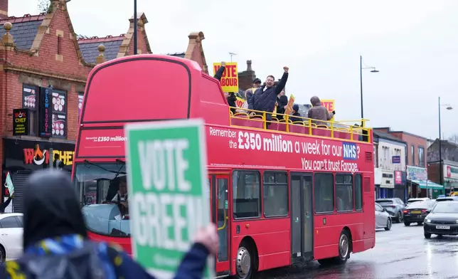 Labour and Green Party supporters in Levenshulme in northwest England, Thursday Feb. 26, 2026, as voters head to the polls in the Gorton and Denton constituency. (AP Photo/Jon Super)