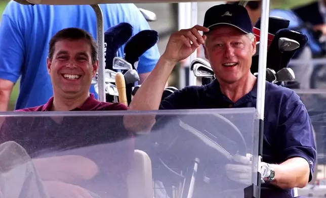 FILE - President Clinton, right, heads out to play a round of golf with Prince Andrew, left, at the Farm Neck Golf Club in Oak Bluffs, Mass., on Martha's Vineyard Friday, Aug. 27, 1999. (AP Photo/Greg Gibson, File)
