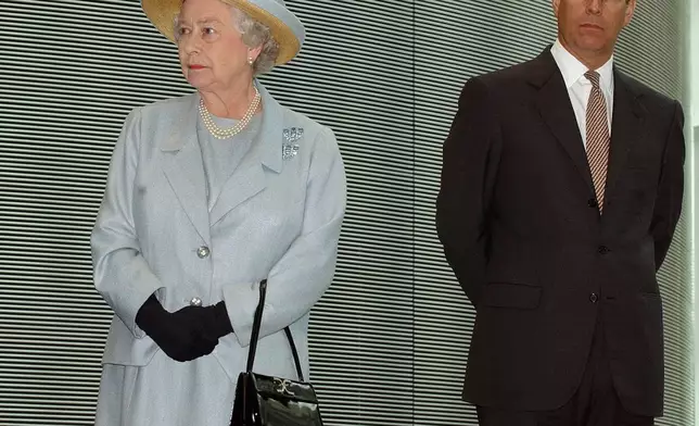 FILE - Britain's Queen Elizabeth II stands next to her son Prince Andrew as they listen to speeches during a visit to Imperial College in London, June 24, 2004. (AP Photo/Richard Lewis, File)