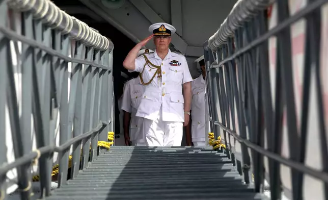 FILE - Britain's Prince Andrew, the Duke of York, salutes during his visit on the Indian aircraft carrier INS Viraat at the Western Naval Command in Mumbai, India, Wednesday, May 2, 2012. (AP Photo/Rajanish Kakade, File)