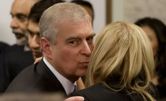 FILE - Britain's Prince Andrew, greets a business leader during a reception at the sideline of the World Economic Forum in Davos, Thursday, Jan. 22, 2015. (AP Photo/Michel Euler, Pool, File)