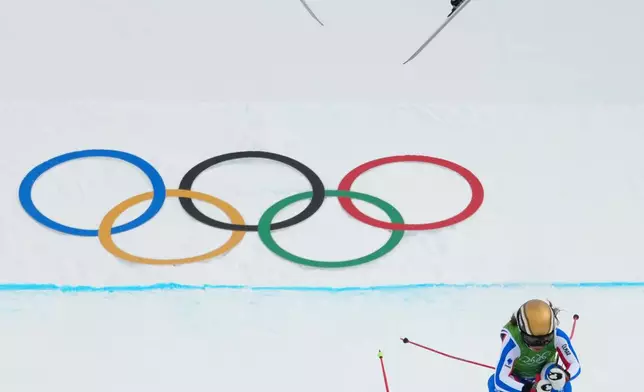 Clock wise from top, Switzerland's Sixtine Cousin (13), France's Jade Grillet Aubert (6) and Switzerland's Talina Gantenbein (5) compete during the women's ski cross finals at the 2026 Winter Olympics, in Livigno, Italy, Friday, Feb. 20, 2026. (AP Photo/Julia Demaree Nikhinson)