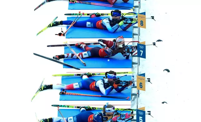 Athletes compete in the women's 4x6-kilometer relay biathlon race at the 2026 Winter Olympics in Anterselva, Italy, Wednesday, Feb. 18, 2026. (AP Photo/Andrew Medichini)