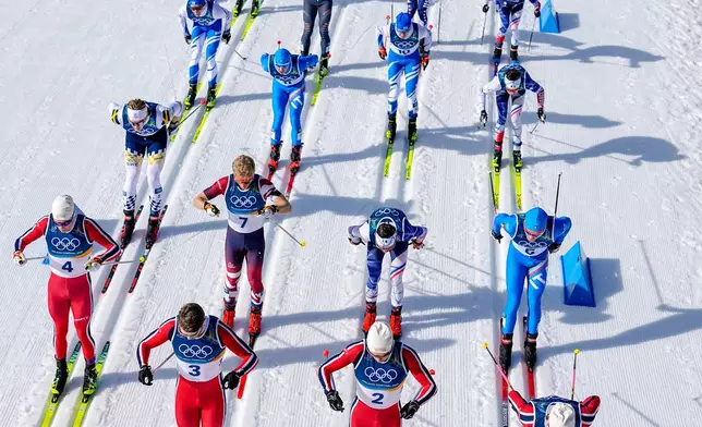 From right, Johannes Hoesflot Klaebo, Harald Oestberg Amundsen, Mattis Stenshagen and Martin Loewstroem Nyenget, all four of Norway, compete in the cross country skiing men's 10km + 10km skiathlon at the 2026 Winter Olympics, in Tesero, Italy, Sunday, Feb. 8, 2026. (AP Photo/Matthias Schrader)