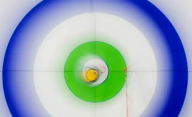 Switzerland's Silvana Tirinzoni competes against Denmark during the women's curling round robin session at the 2026 Winter Olympics, in Cortina d'Ampezzo, Italy, Wednesday, Feb. 18, 2026. (AP Photo/Christophe Ena)