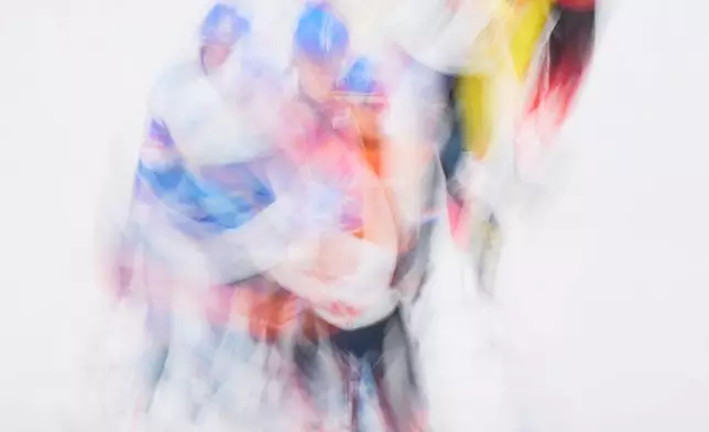 Athletes compete during the women's mass start final speedskating race at the 2026 Winter Olympics, in Milan, Italy, Saturday, Feb. 21, 2026. (AP Photo/Bernat Armangue)
