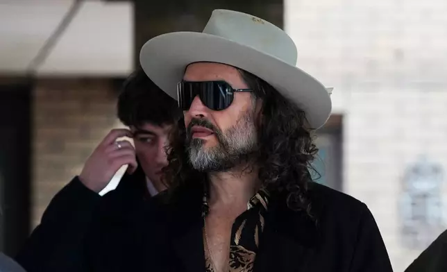 Russell Brand leaves Southwark Crown Court, in London, Tuesday, Feb. 24, 2026. (AP Photo/Alberto Pezzali)
