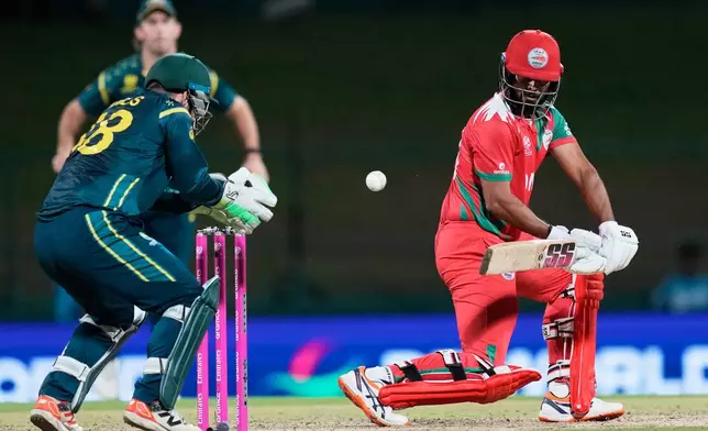 Oman's Vinayak Shukla plays a shot during the T20 World Cup cricket match between Australia and Oman in Pallekele, Sri Lanka, Friday, Feb. 20, 2026. (AP Photo/Eranga Jayawardena)
