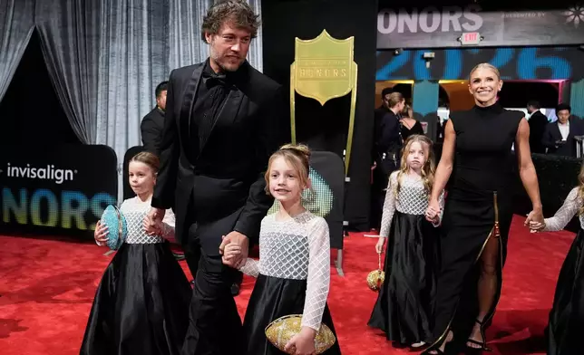 Los Angeles Rams' Matthew Stafford, top left, and his wife, Kelly Stafford, arrive with their family for football's NFL Honors award show in San Francisco, Thursday, Feb. 5, 2026. (AP Photo/Brynn Anderson)