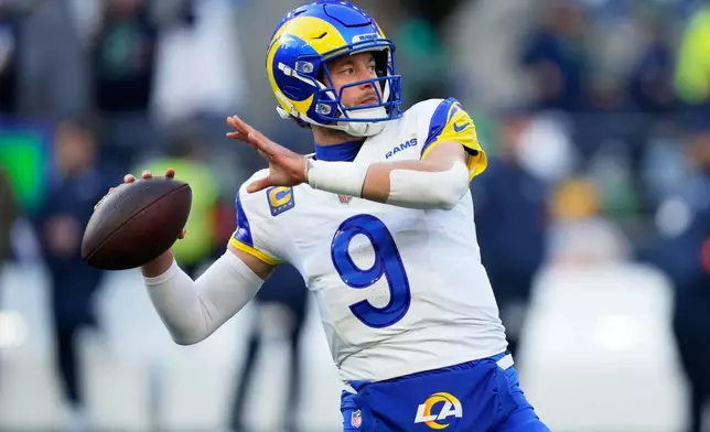 Los Angeles Rams quarterback Matthew Stafford warms up before the NFC Championship NFL football game against the Seattle Seahawks, Sunday, Jan. 25, 2026, in Seattle. (AP Photo/Stephen Brashear)