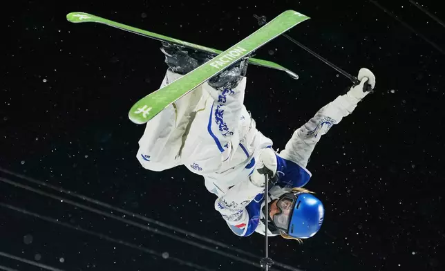 China's Eileen Gu competes during the women's freestyle skiing halfpipe qualifications at the 2026 Winter Olympics, in Livigno, Italy, Thursday, Feb. 19, 2026. (AP Photo/Julia Demaree Nikhinson)